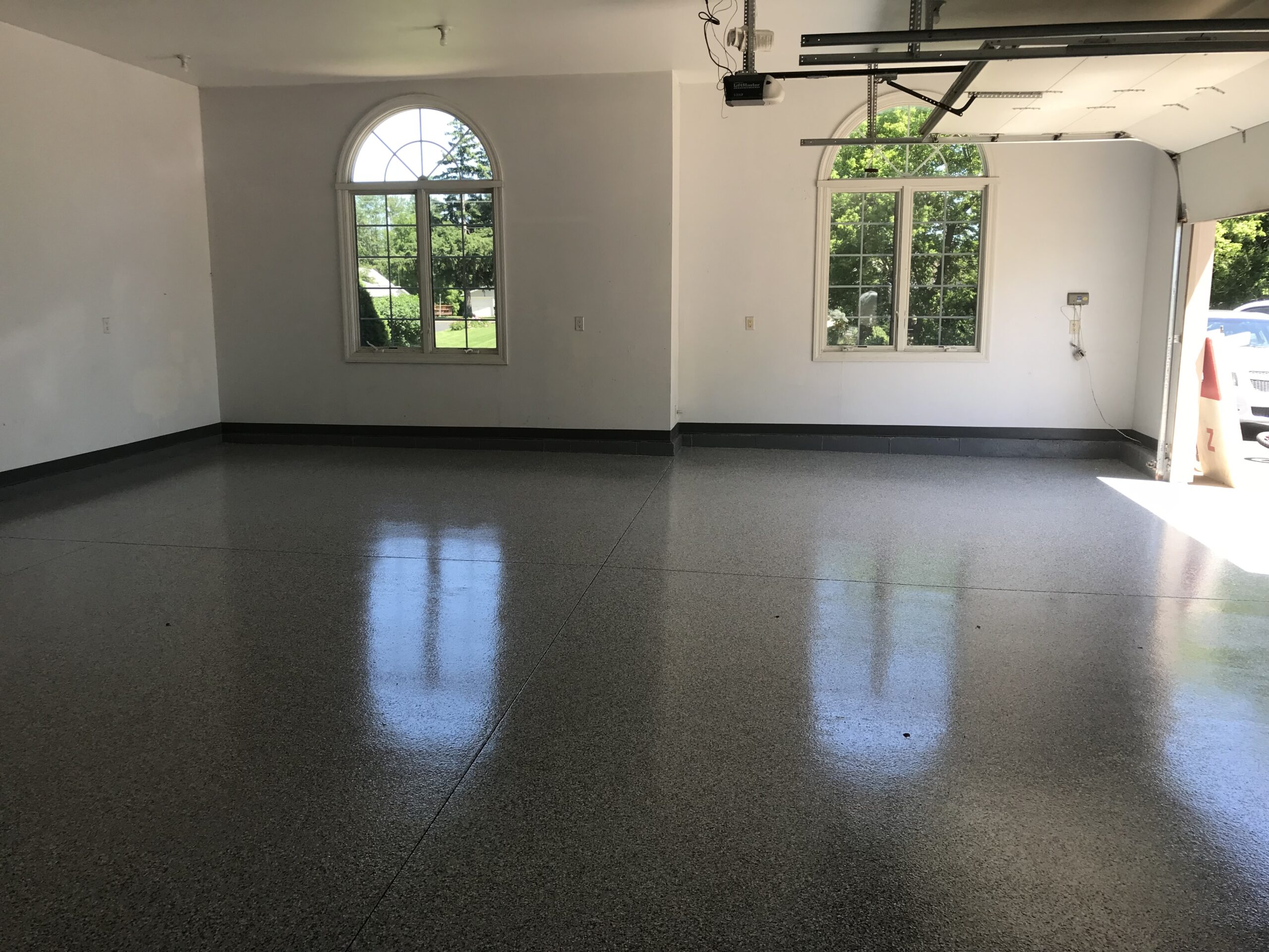 Bright garage with glossy epoxy floor